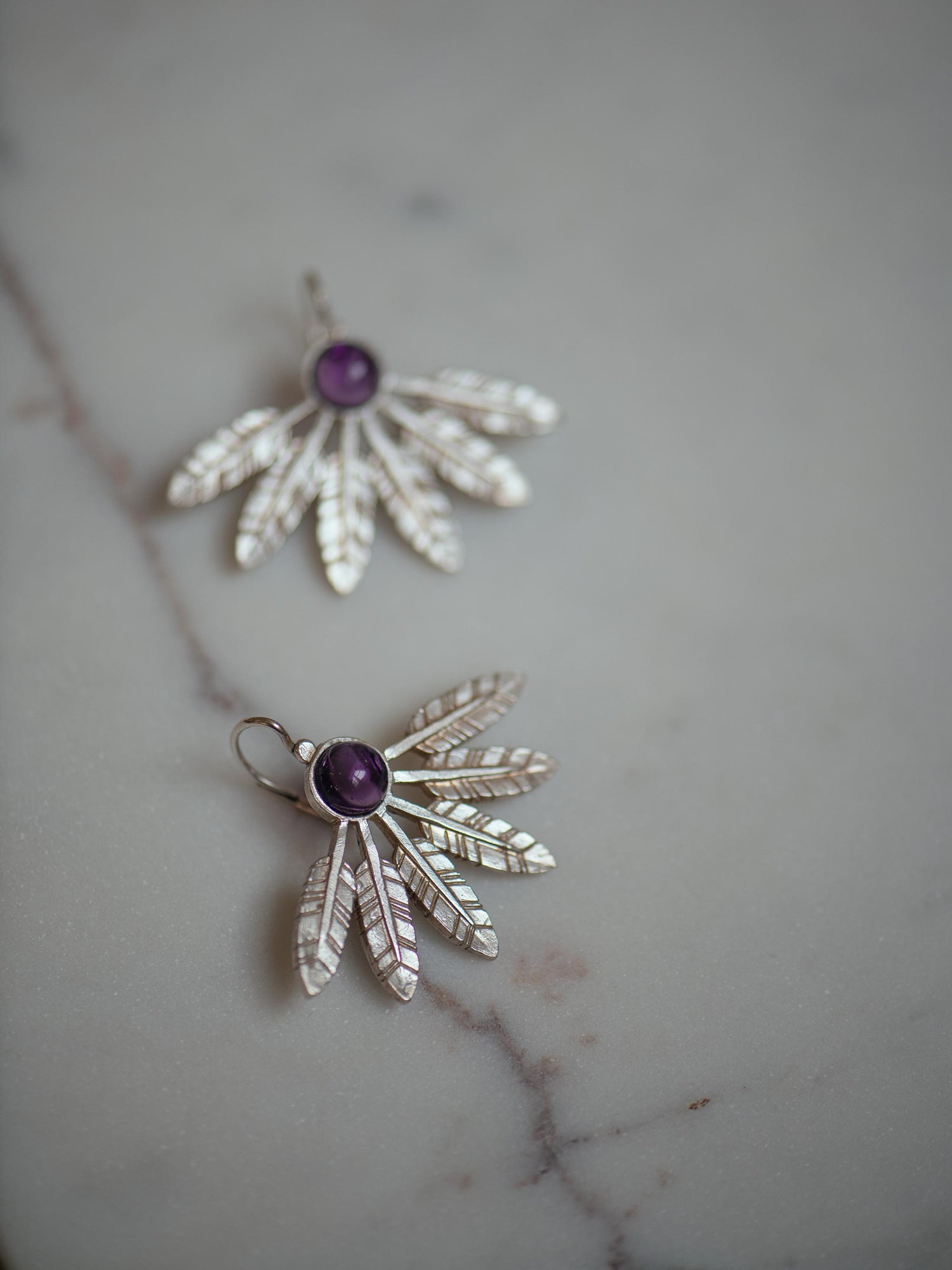 Feather large earrings